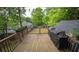 This deck is a great space to grill and relax with potted plants, lighting and views to the backyard at 2881 Parrott Nw Ave, Atlanta, GA 30318