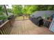 The deck features lovely plants, covered grills and wood flooring at 2881 Parrott Nw Ave, Atlanta, GA 30318