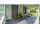 Inviting front porch with comfortable seating, perfect for relaxing outdoors in a quiet setting at 2881 Parrott Nw Ave, Atlanta, GA 30318