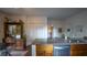 Cozy kitchen featuring granite counters, stainless dishwasher, with vintage display cabinet at 2881 Parrott Nw Ave, Atlanta, GA 30318