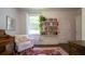 Well-lit office area with a comfy chair and built-in shelving at 2881 Parrott Nw Ave, Atlanta, GA 30318