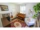 Charming office space featuring a piano, comfortable chair, and a decorative fireplace at 2881 Parrott Nw Ave, Atlanta, GA 30318