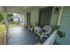 Inviting front porch with white wicker chairs and blue accents at 2881 Parrott Nw Ave, Atlanta, GA 30318