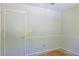 Neutral bedroom featuring wood trim, freshly painted walls, and closet storage space at 3785 Willow Ridge Rd, Douglasville, GA 30135