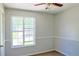 This light and airy bedroom offers natural light through a large window and carpet flooring at 3785 Willow Ridge Rd, Douglasville, GA 30135
