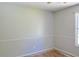Neutral colored bedroom featuring wood trim, painted walls, and an ample window offering natural light at 3785 Willow Ridge Rd, Douglasville, GA 30135