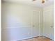 This neutral bedroom features a closet, painted walls, wood trim, and a ceiling fan at 3785 Willow Ridge Rd, Douglasville, GA 30135