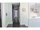 View of a gray hallway with hardwood floors and white trim leading to other rooms in the home at 3785 Willow Ridge Rd, Douglasville, GA 30135