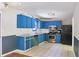 A kitchen featuring blue cabinets and stainless steel appliances at 3785 Willow Ridge Rd, Douglasville, GA 30135