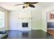 Spacious living room featuring a decorative fireplace and dark hardwood floors at 3785 Willow Ridge Rd, Douglasville, GA 30135