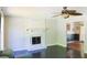 Cozy living room featuring hardwood floors, a fireplace, and a ceiling fan at 3785 Willow Ridge Rd, Douglasville, GA 30135