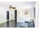 Open-concept living room with ceiling fan, hardwood floors, and view to the kitchen at 3785 Willow Ridge Rd, Douglasville, GA 30135