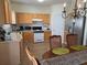 Bright eat-in kitchen with stainless steel appliances, gas range, and wood cabinetry, perfect for everyday meals at 3828 Dandridge Way, Duluth, GA 30096