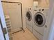 Convenient laundry room equipped with modern washer and dryer units, maximizing space and functionality at 3828 Dandridge Way, Duluth, GA 30096