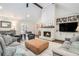 Spacious living room with a fireplace, built-in shelves, and comfortable seating arrangement at 751 Yorkshire Sw Pl, Lilburn, GA 30047