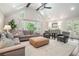 Large living room with vaulted ceiling, lots of windows, and modern furnishings at 751 Yorkshire Sw Pl, Lilburn, GA 30047