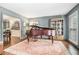 Stylish living room showcasing hardwood floors, piano, detailed trim, and an open layout at 751 Yorkshire Sw Pl, Lilburn, GA 30047