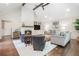 Bright living room with high ceilings, fireplace, and comfortable seating area at 751 Yorkshire Sw Pl, Lilburn, GA 30047
