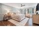 Serene main bedroom boasting hardwood floors, a comfy king bed, and wainscoting at 751 Yorkshire Sw Pl, Lilburn, GA 30047