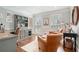 Bright home office featuring built-in shelving, comfortable seating, and natural lighting at 751 Yorkshire Sw Pl, Lilburn, GA 30047