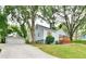 Charming home featuring a well-maintained lawn, mature trees, and detached garage at 1626 Oak Knoll Se Cir, Atlanta, GA 30315