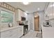 Bright kitchen with white cabinets, stainless steel appliances, and quartz countertops at 1626 Oak Knoll Se Cir, Atlanta, GA 30315