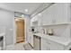 Modern kitchen featuring white cabinets, stainless steel appliances, and ample counter space at 1626 Oak Knoll Se Cir, Atlanta, GA 30315
