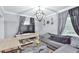 Cozy living room with a comfortable sofa, modern lighting, and a decorative rug at 1626 Oak Knoll Se Cir, Atlanta, GA 30315