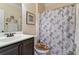Bathroom with vanity, seashell-themed shower curtain, and coordinating accessories at 305 Spooner Dr, Mcdonough, GA 30252