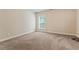 Empty bedroom with neutral carpet, and trim, awaiting your personal touches at 305 Spooner Dr, Mcdonough, GA 30252