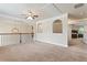 Upstairs bonus room with neutral carpet, trim, and railing overlooking lower level at 305 Spooner Dr, Mcdonough, GA 30252
