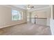 Upstairs bonus room with neutral carpet, trim, and a large window at 305 Spooner Dr, Mcdonough, GA 30252