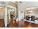 Grand foyer with hardwood floors, staircase, and dining room, creating a welcoming entrance at 305 Spooner Dr, Mcdonough, GA 30252