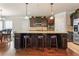 Spacious kitchen with a large island, dark wood cabinets, and granite countertops at 305 Spooner Dr, Mcdonough, GA 30252