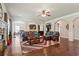 Expansive living room with hardwood floors, a cozy fireplace, and seamless open-concept design for modern living at 305 Spooner Dr, Mcdonough, GA 30252
