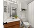 Bathroom featuring a vanity, updated light fixtures, and shower with white curtain at 4941 Meadow Lane, Marietta, GA 30068