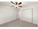 Comfortable bedroom featuring neutral carpet, a ceiling fan, and a closet at 4941 Meadow Lane, Marietta, GA 30068