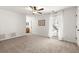 Spacious bedroom with soft carpet, neutral paint, a ceiling fan, and a bright window at 4941 Meadow Lane, Marietta, GA 30068