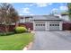 The home features a two-car garage, mature landscaping, and a private front yard at 4941 Meadow Lane, Marietta, GA 30068