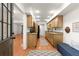 Galley kitchen with granite countertops, stainless steel appliances, and wood cabinets with a view of the dining room at 4941 Meadow Lane, Marietta, GA 30068
