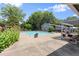 Community pool with lounge chairs, a pergola, and a view of mature trees at 4941 Meadow Lane, Marietta, GA 30068