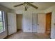Bright bedroom with a ceiling fan features closet and natural light from a window at 2068 Hampton Locust Grove Rd, Locust Grove, GA 30248