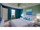 Bedroom showcasing bright wall colors, a ceiling fan, and natural light from the window at 2068 Hampton Locust Grove Rd, Locust Grove, GA 30248