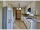 Galley kitchen with white cabinets, and bright lighting at 2068 Hampton Locust Grove Rd, Locust Grove, GA 30248