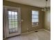 Bright kitchen/dining area with a door to the outside; needs TLC but could be a lovely spot at 2068 Hampton Locust Grove Rd, Locust Grove, GA 30248