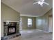 Spacious living room with vaulted ceiling and a beautiful stone fireplace, waiting for your personal touch at 2068 Hampton Locust Grove Rd, Locust Grove, GA 30248