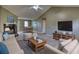 Inviting living room featuring a cozy stone fireplace, neutral decor, and ample natural light at 2068 Hampton Locust Grove Rd, Locust Grove, GA 30248