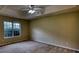 Main bedroom with comfortable carpet, and a tray ceiling at 2068 Hampton Locust Grove Rd, Locust Grove, GA 30248