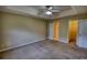 Main bedroom with comfortable carpet, and a tray ceiling at 2068 Hampton Locust Grove Rd, Locust Grove, GA 30248