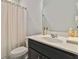 The bathroom has a single vanity, light walls, and shower and toilet combo at 340 Paulownia Cir, Mcdonough, GA 30253